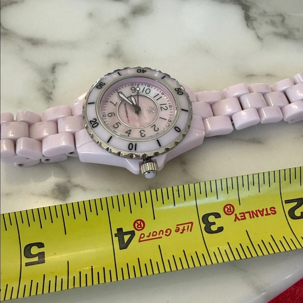 Isaac Mizrahi Live women’s pink sport watch with bracelet style band